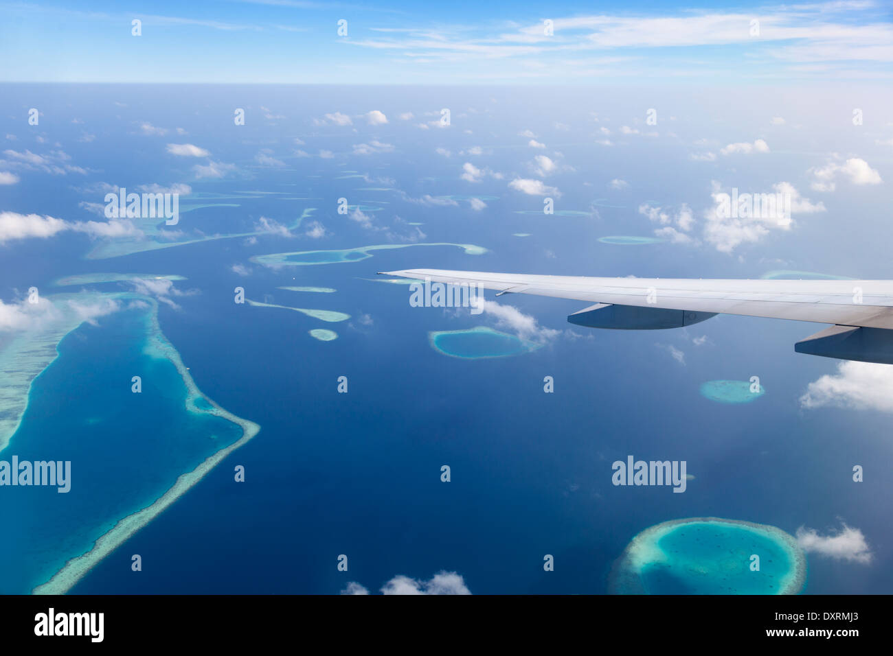 View from the window of an airplane flying above the Maldive Islands in the Indian Ocean 9 Stock Photo