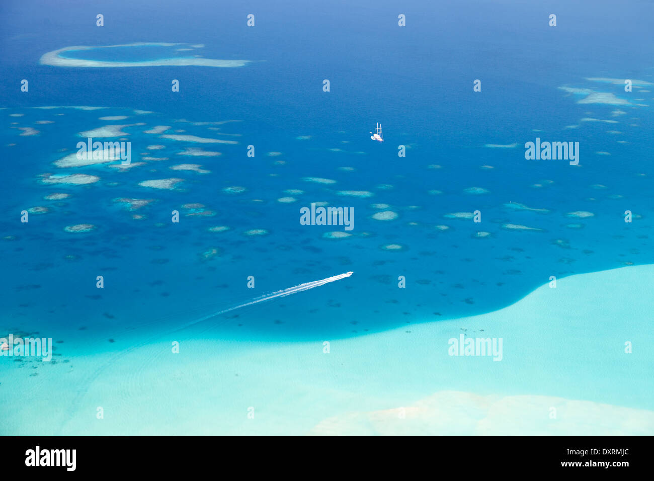 View from the window of an airplane flying above the Maldive Islands in the Indian Ocean 14 Stock Photo