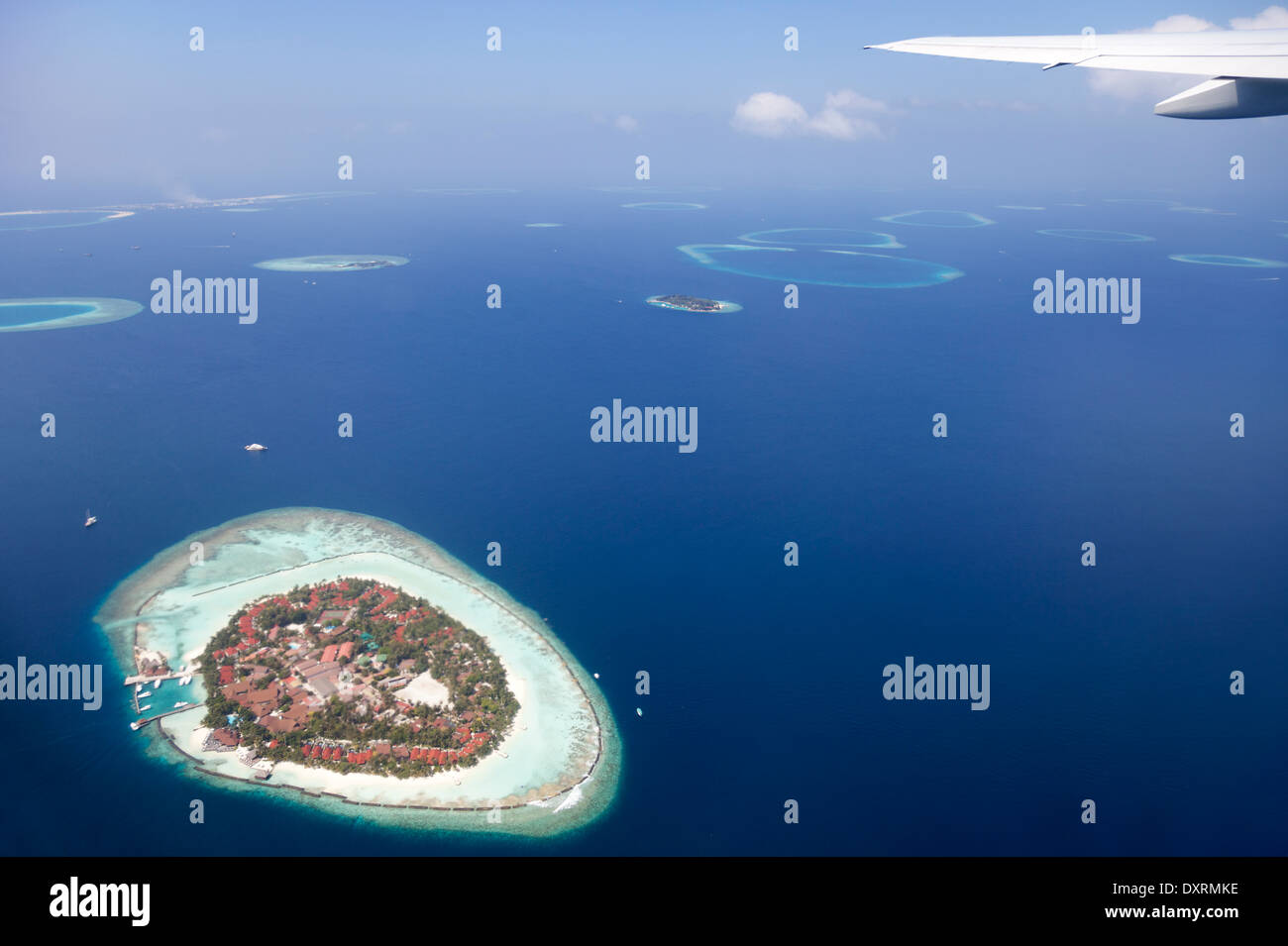 View from the window of an airplane flying above the Maldive Islands in the Indian Ocean 6 Stock Photo