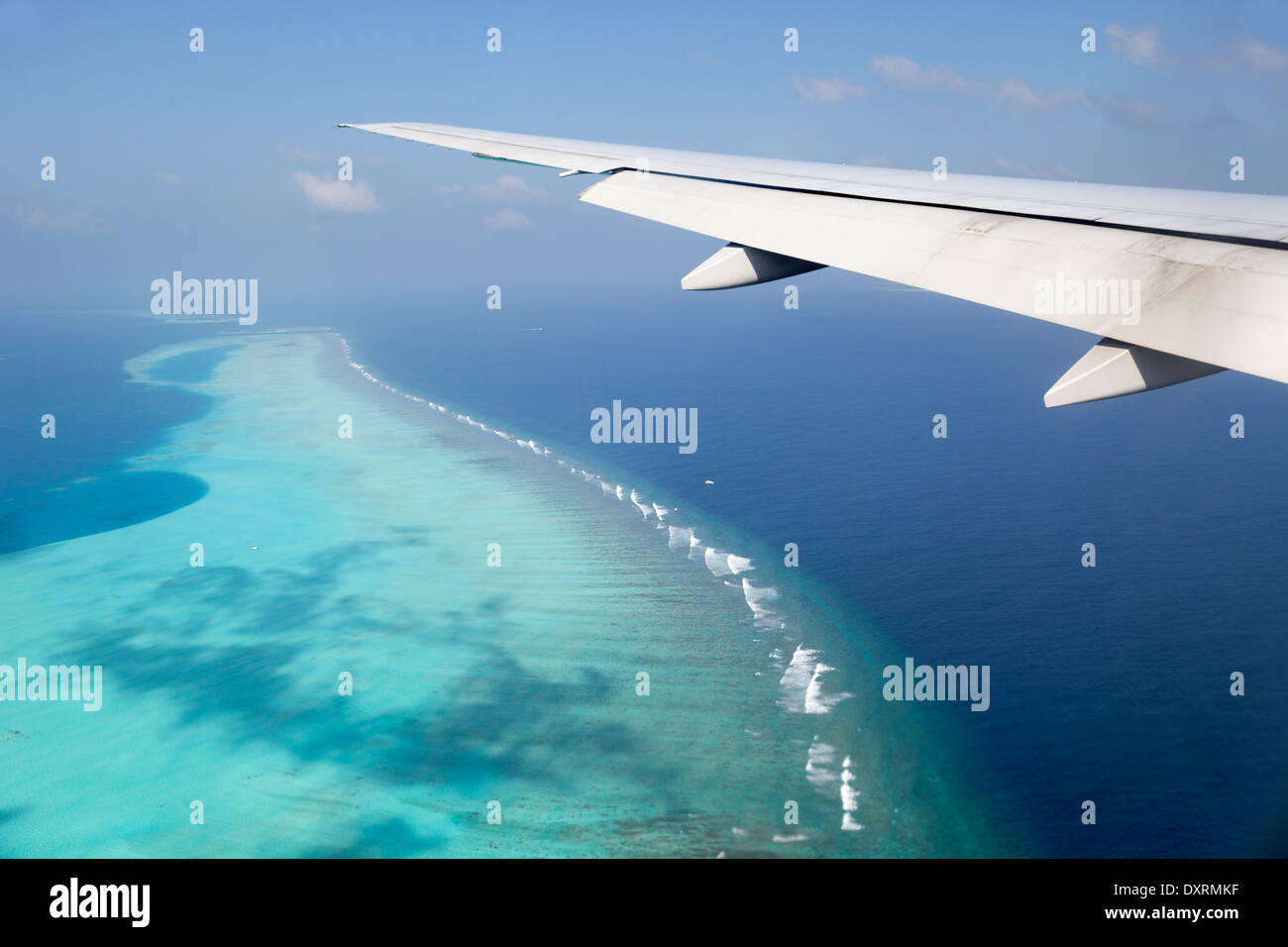 View from the window of an airplane flying above the Maldive Islands in the Indian Ocean 10 Stock Photo