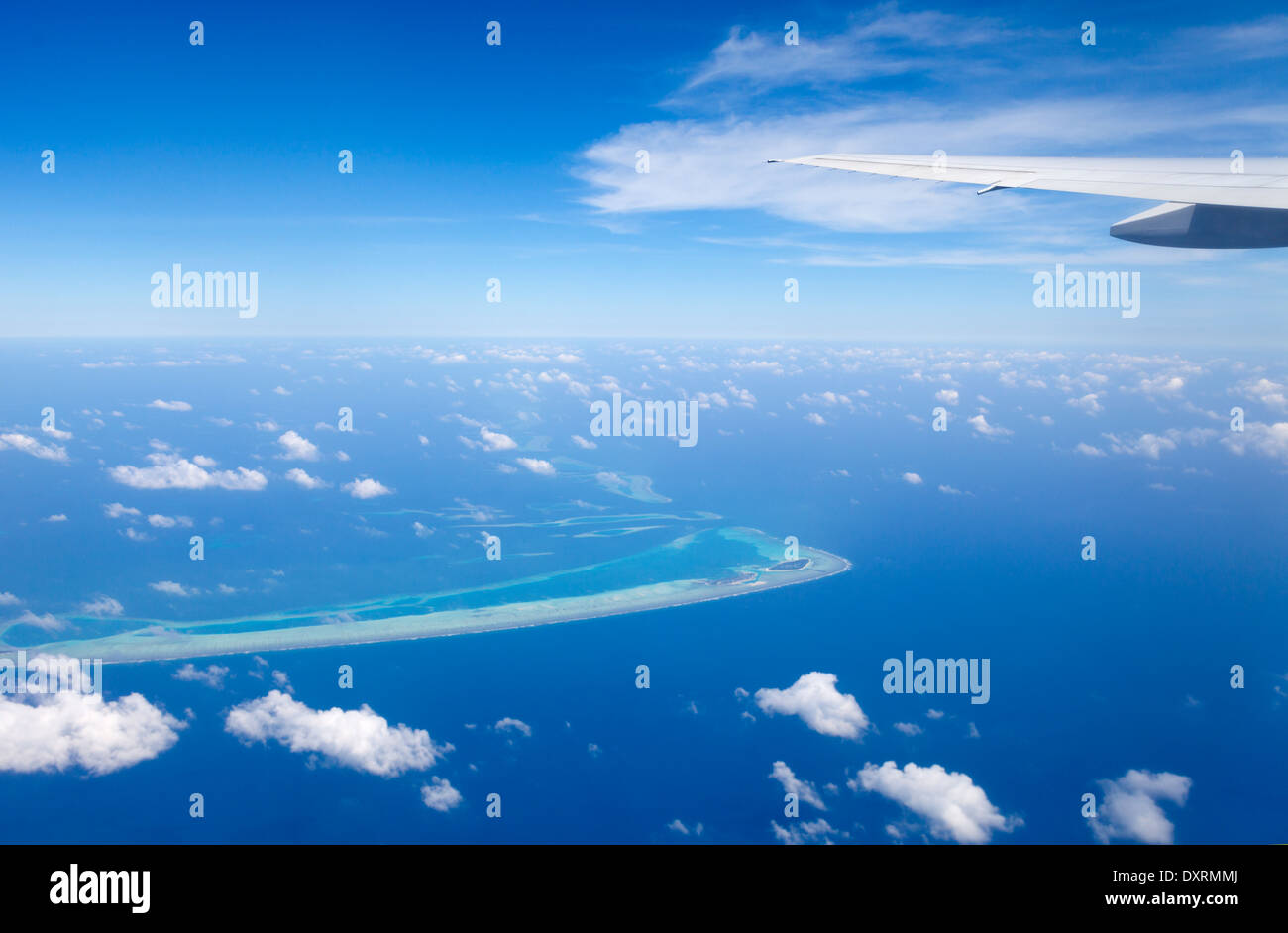 View from the window of an airplane flying above the Maldive Islands in the Indian Ocean 3 Stock Photo