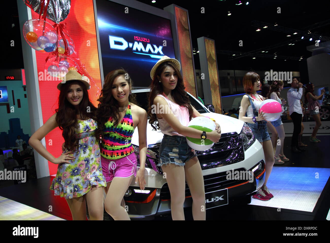 Bangkok, Thailand. 28th March 2014.  Presenters posing with Isuzu D-Max during The 35th Bangkok International Motor Show . The 35th Bangkok International Motor Show; will be held from March 26 to April 6 Credit:  John Vincent/Alamy Live News Stock Photo