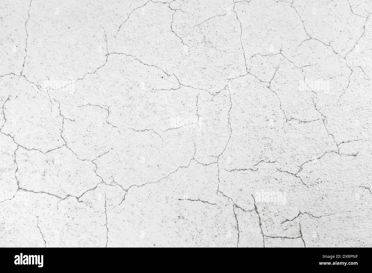 Closeup white concrete wall texture with cracked stucco Stock Photo