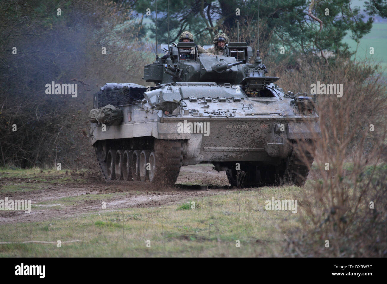 FV510 Warrior IFV traveling over rough terrain on Salisbury Plain Training Area during an exercise Stock Photo