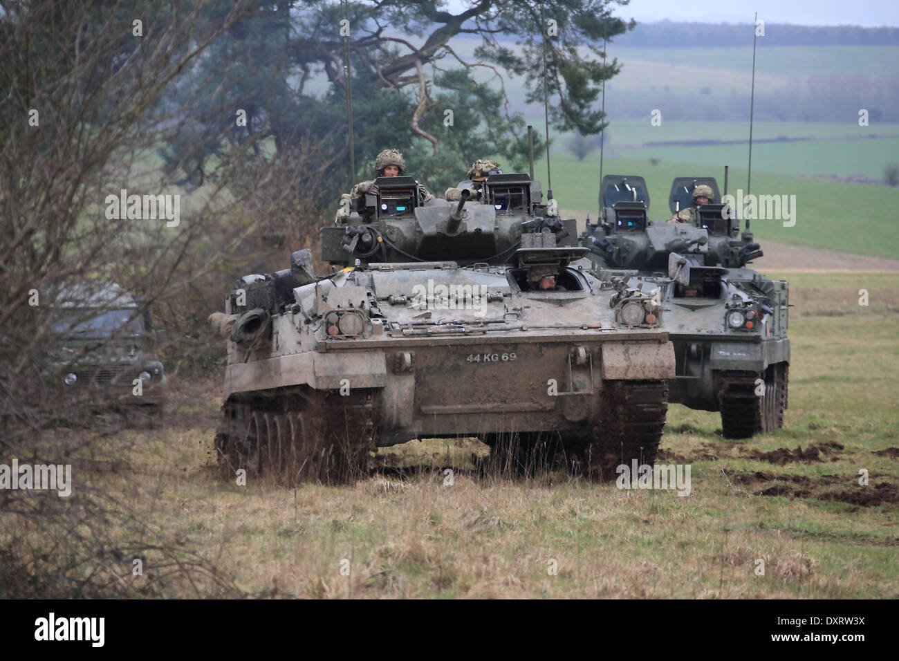 FV510 Warrior IFV traveling over rough terrain on Salisbury Plain Training Area during an exercise Stock Photo