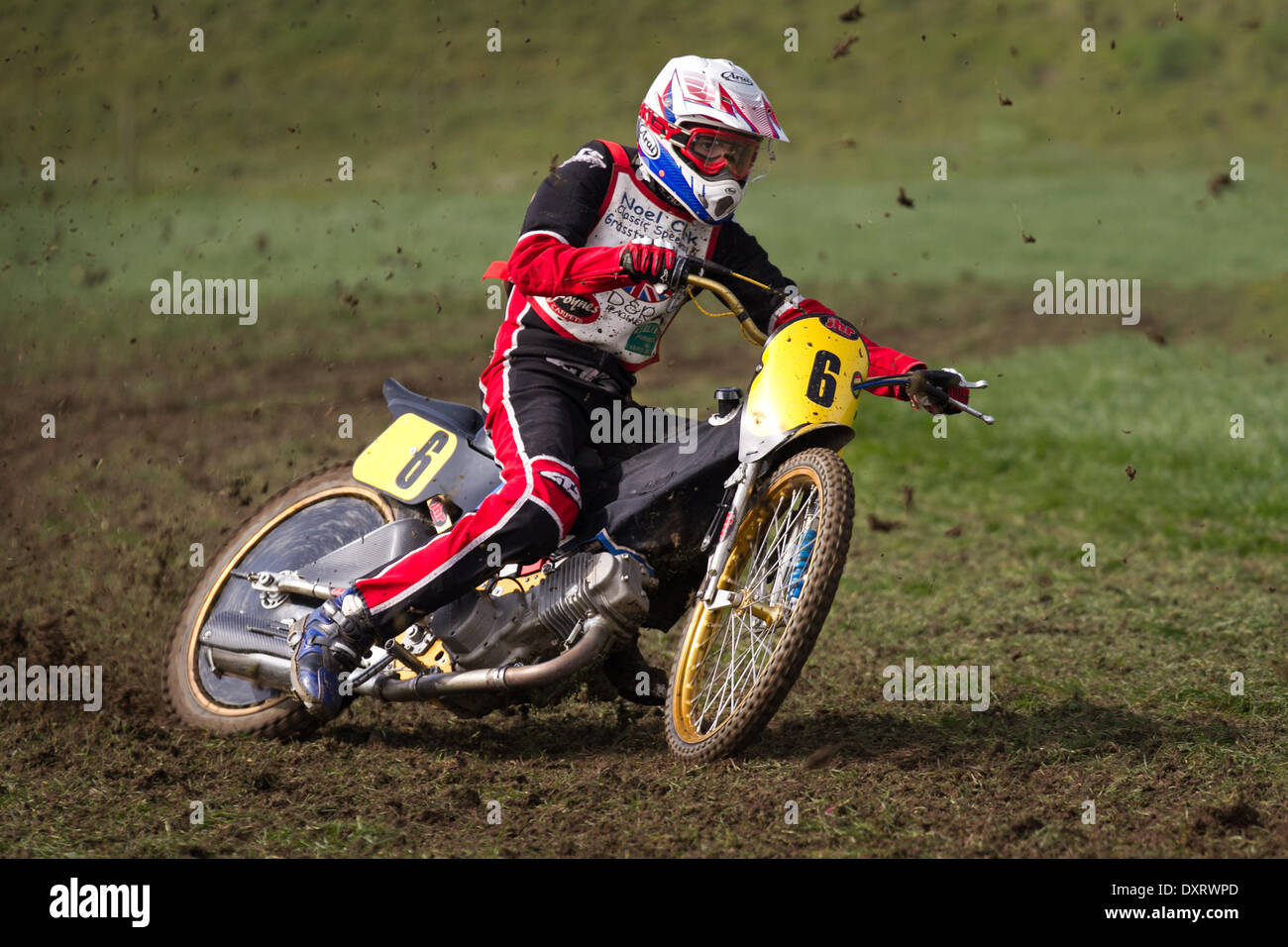 Youngsters grass track motorcycle riding in Much Hoole, Lancashire, UK March, 2014. Rob Finlow No.6  MX65 racer at the first ever meeting of the Lancashire Offroad Grasstrack Association held at Lower Marsh Farm, Much Hoole, Preston. A junior motorcycle race, grass track, speed, bike, motorbike, motorsport, power, winner, racing, motocross, competition, extreme sports, helmet, wheel, moto, sport, rider, cross, fun, jump, riding, sports, trail, dirt, fast event held under the National Sporting Code rules of the ACU standing regulations for grass tracks. Stock Photo