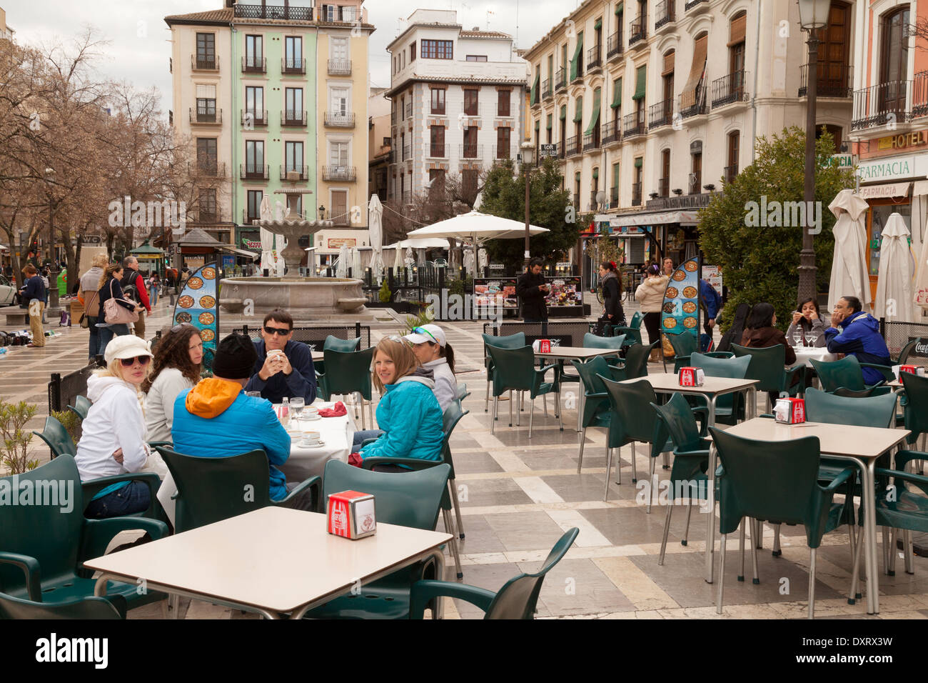 People sitting at an outdoor cafe, Plaza Nueva, Granada Andalusia Spain Europe Stock Photo