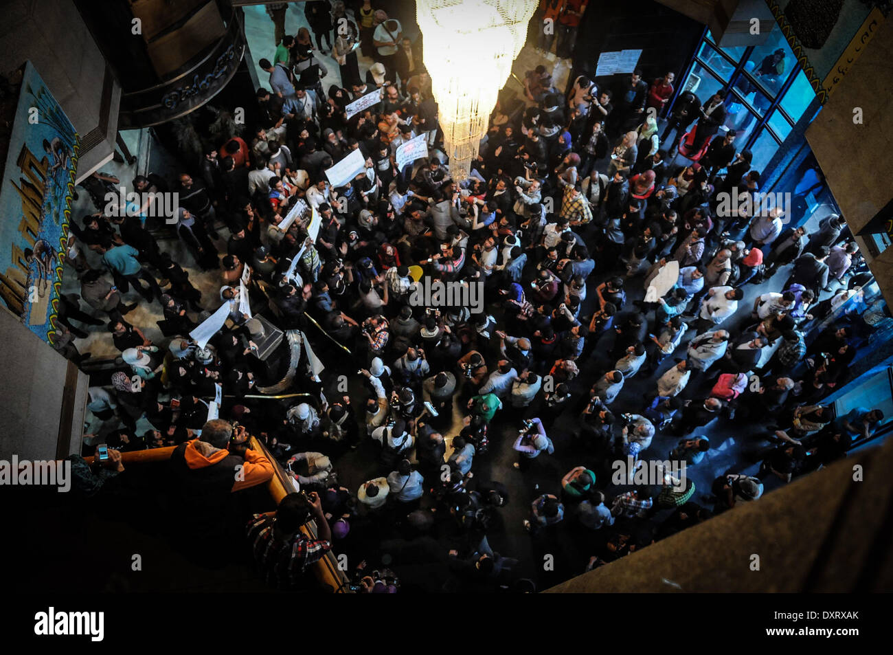 Cairo, Egypt. 29th Mar, 2014. Dozens of journalists and activists, inside the lobby of the Journalists' Syndicate, on Saturday evening, to condemn the killing of Mayada Ashraf, working on liberated newspaper Â«DoustorÂ», during coverage of the clashes between demonstrators belonging to MB and security forces. Journalist who died amid Friday clashes between police and Muslim Brotherhood supporters was killed by a gunshot wound to the head, according to forensics official Hisham Abdel Hamid. 22 year-old journalist Mayada Ashraf, who was killed during clashes between Egyptian police and Muslim B Stock Photo