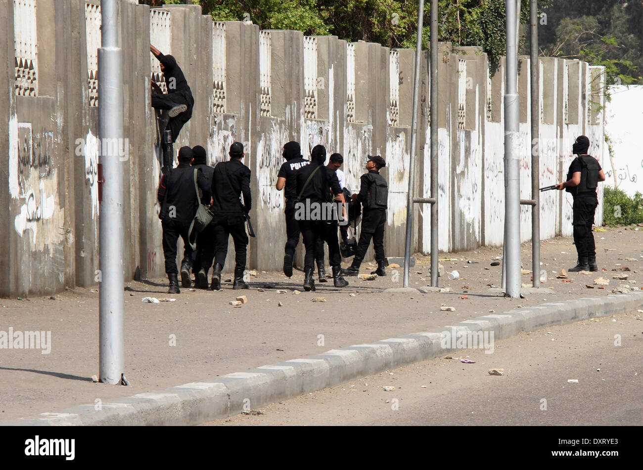 Cairo, Egypt. 30th Mar, 2014. Riot police take their positions along ...