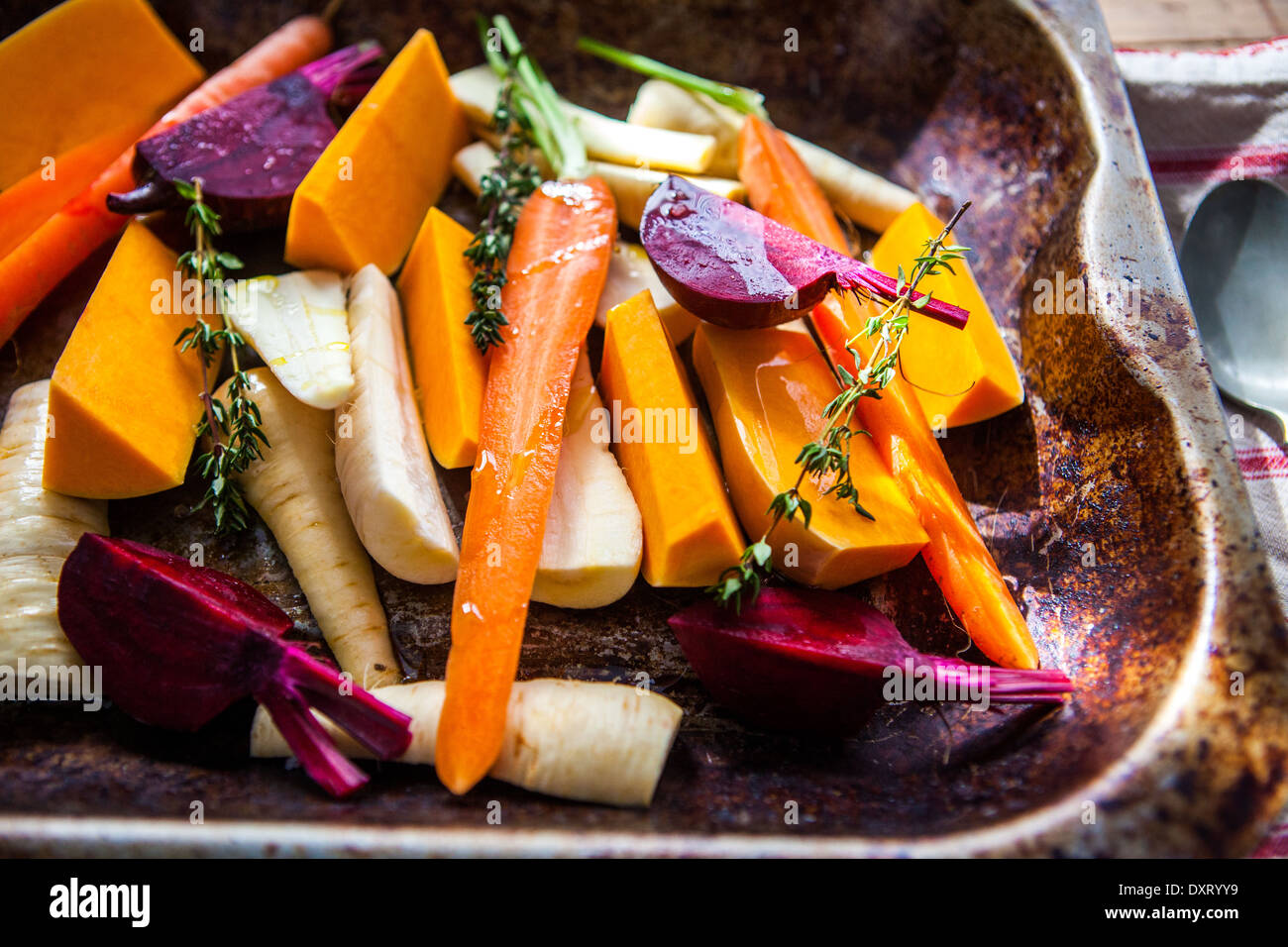 A tray of oven roasted vegetables Stock Photo
