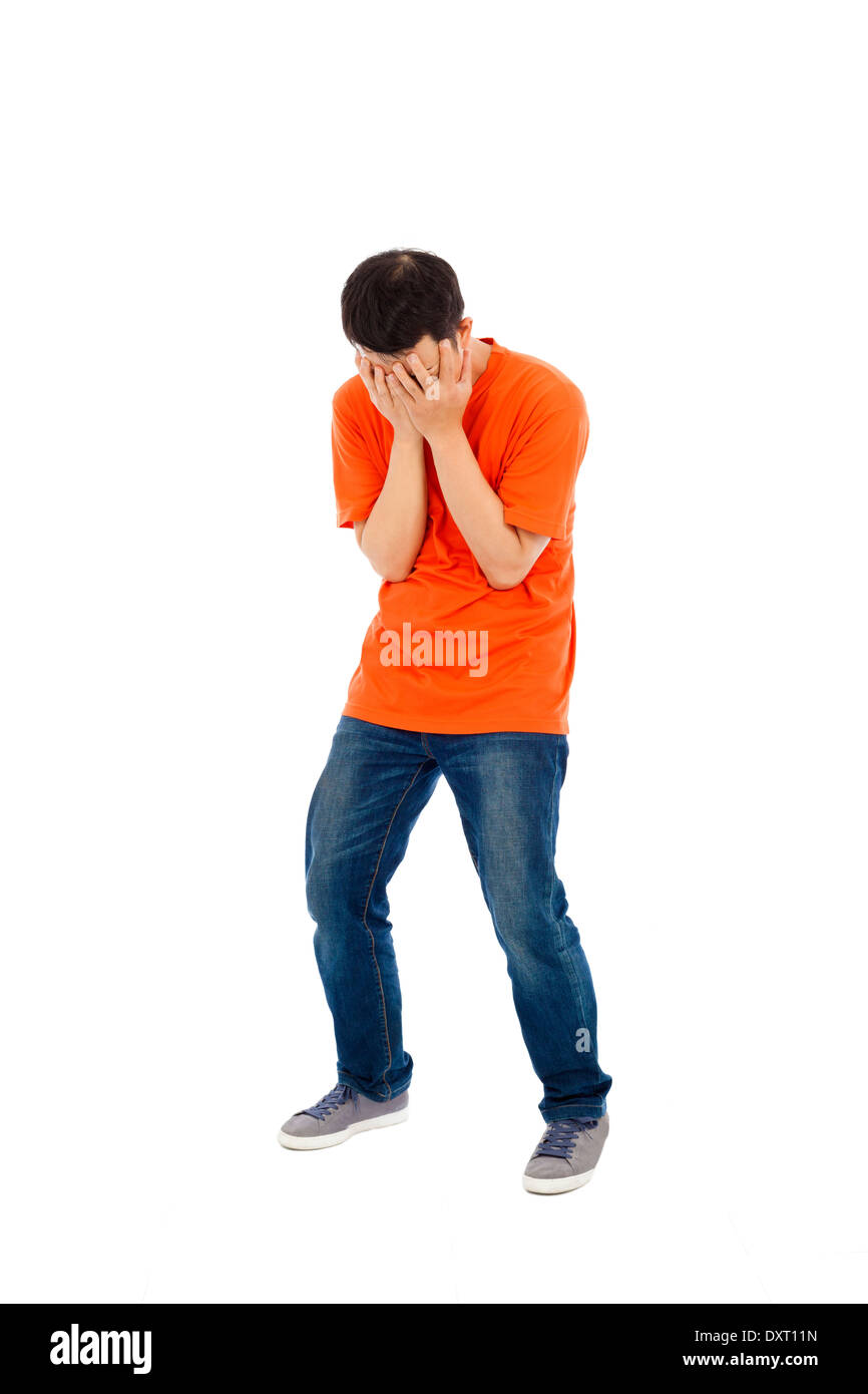 young man feel disappoint to covering face Stock Photo