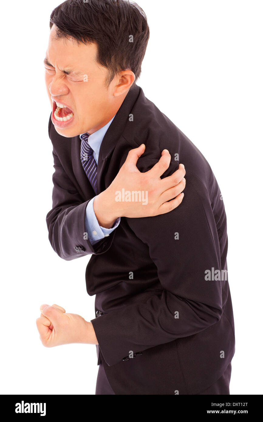businessman having shoulder pain and painful expression Stock Photo