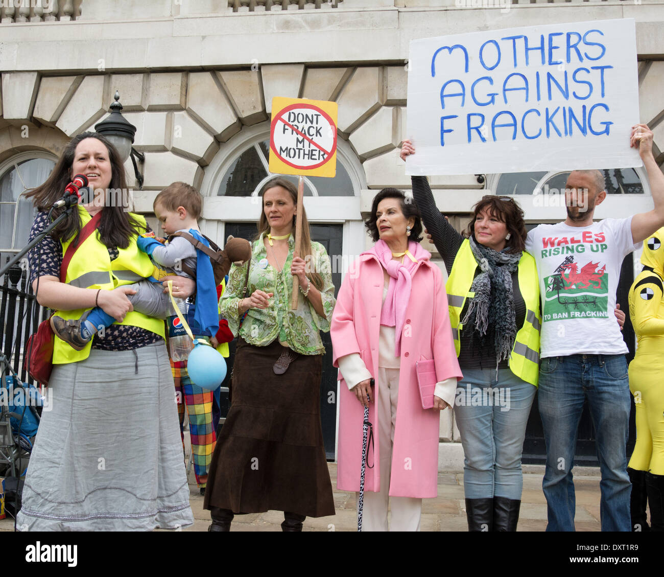 London UK. 30 March 2014. Bianca Jagger (fourth from right, wearing pink) lends her support to the Mothers Against Fracking rally at Old Palace Yard in Westminster. Held to co-incide with Mothers Day, it was a family protest called to demonstrate the opposition of entire families to fracking in the UK. Credit:  Patricia Phillips/Alamy Live News Stock Photo