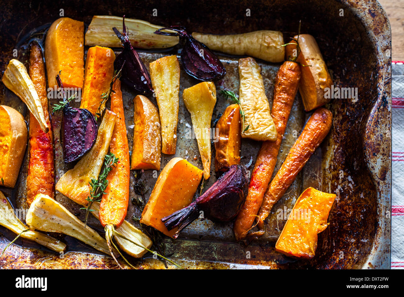 A tray of oven roasted vegetables Stock Photo