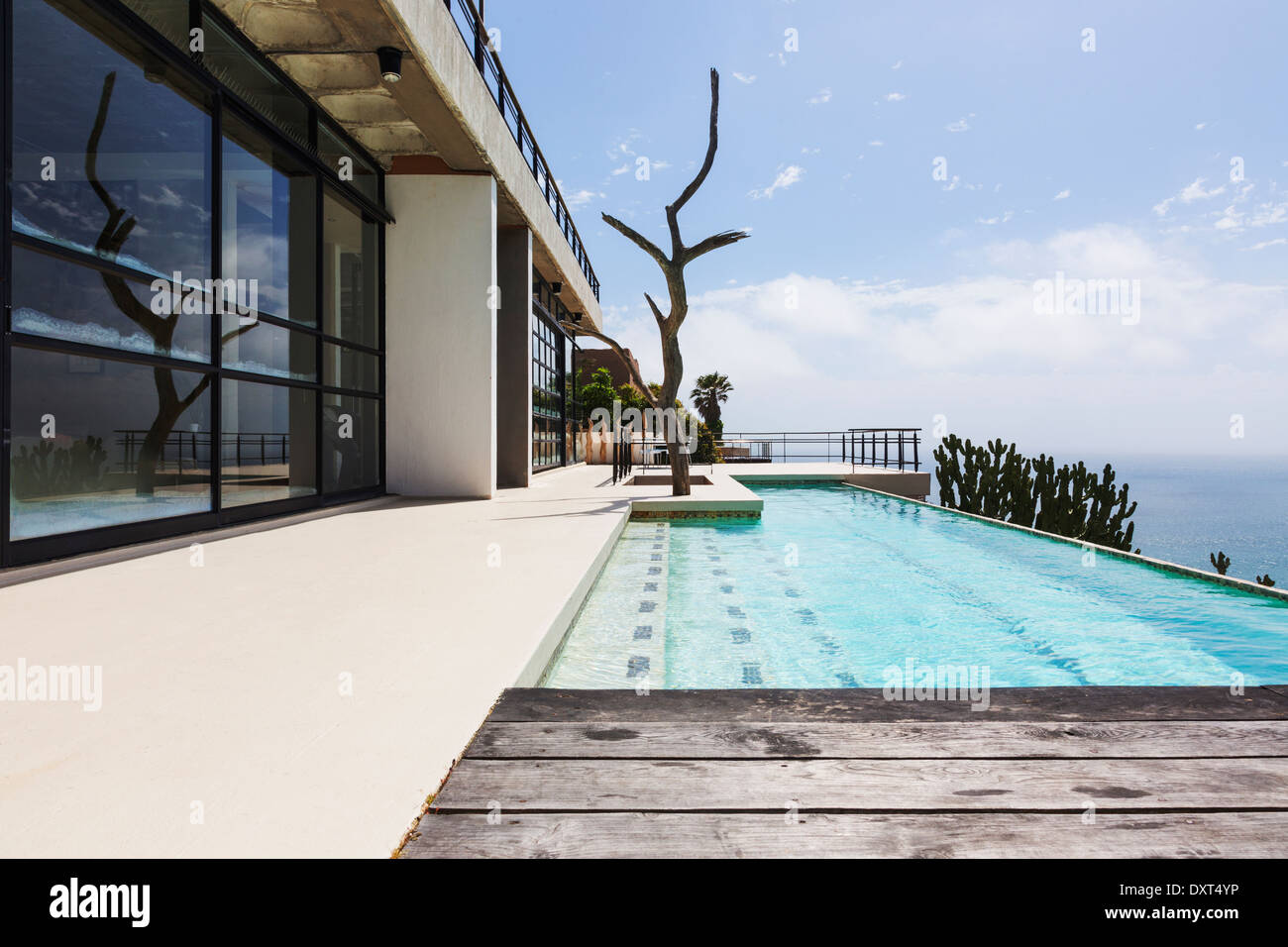 Luxury lap pool overlooking ocean Stock Photo