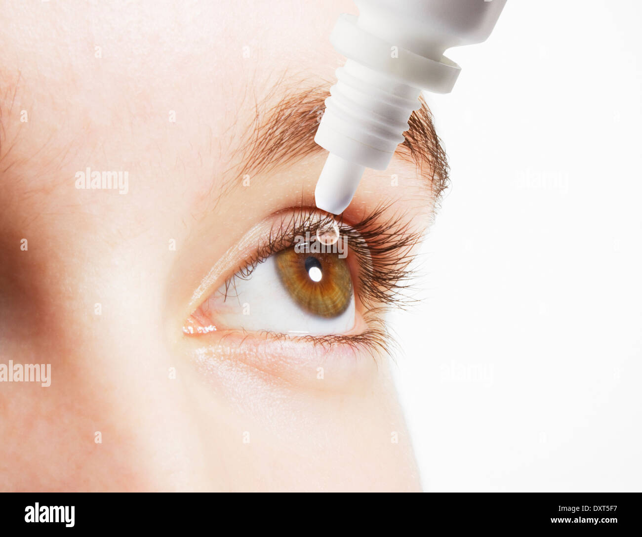 Extreme close up of woman inserting eye drops in eye Stock Photo Alamy