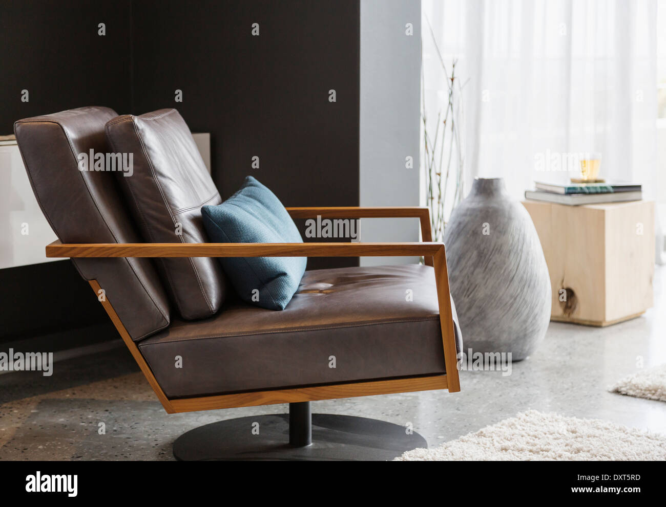 Armchair in modern living room Stock Photo - Alamy
