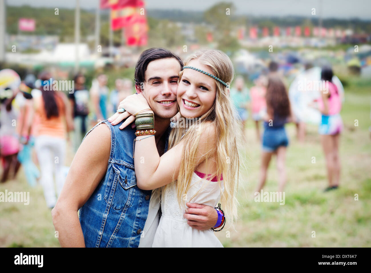 Portrait of couple hugging at music festival Stock Photo