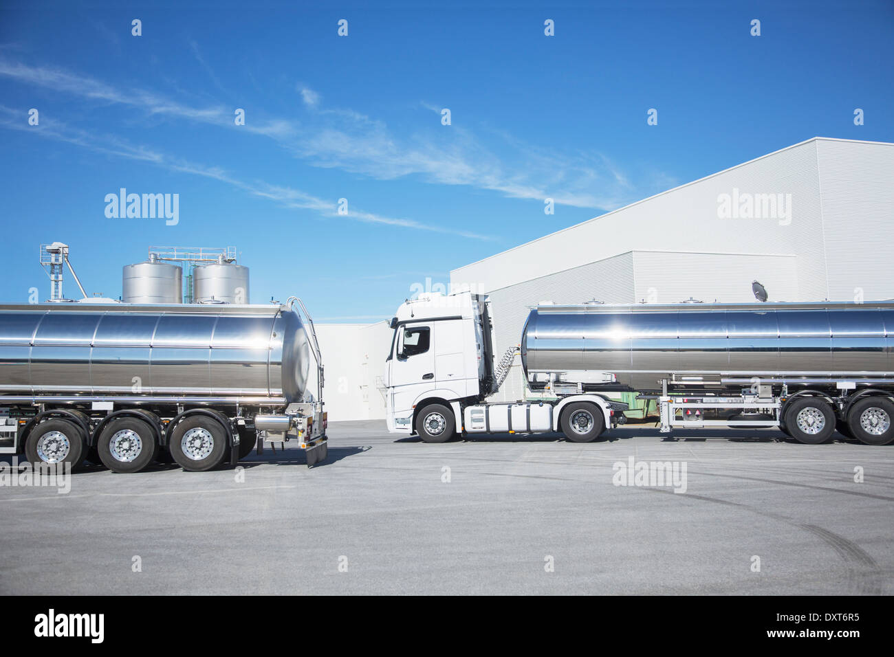 Stainless steel milk tankers parked Stock Photo