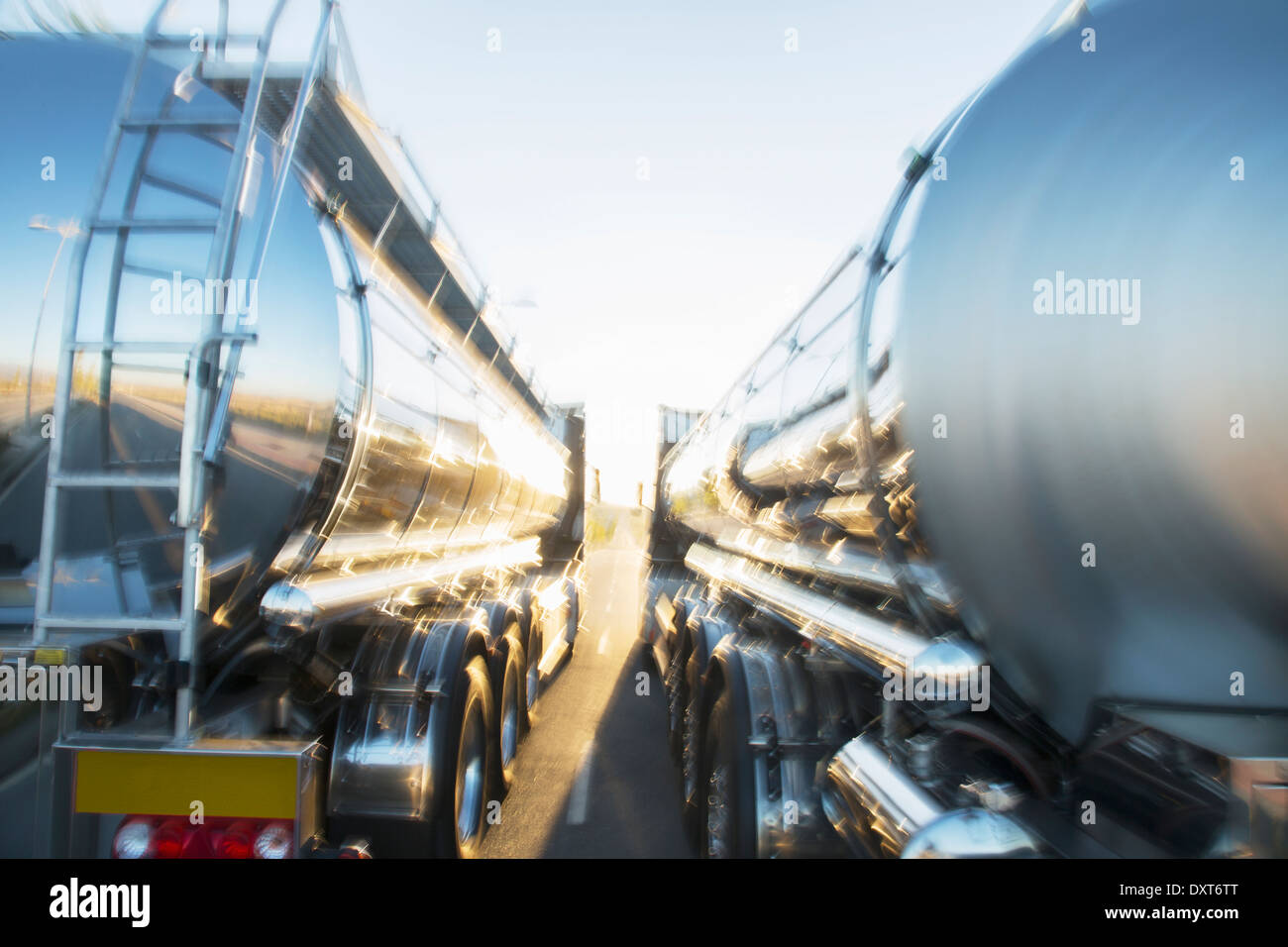 Stainless steel milk tankers side by side Stock Photo