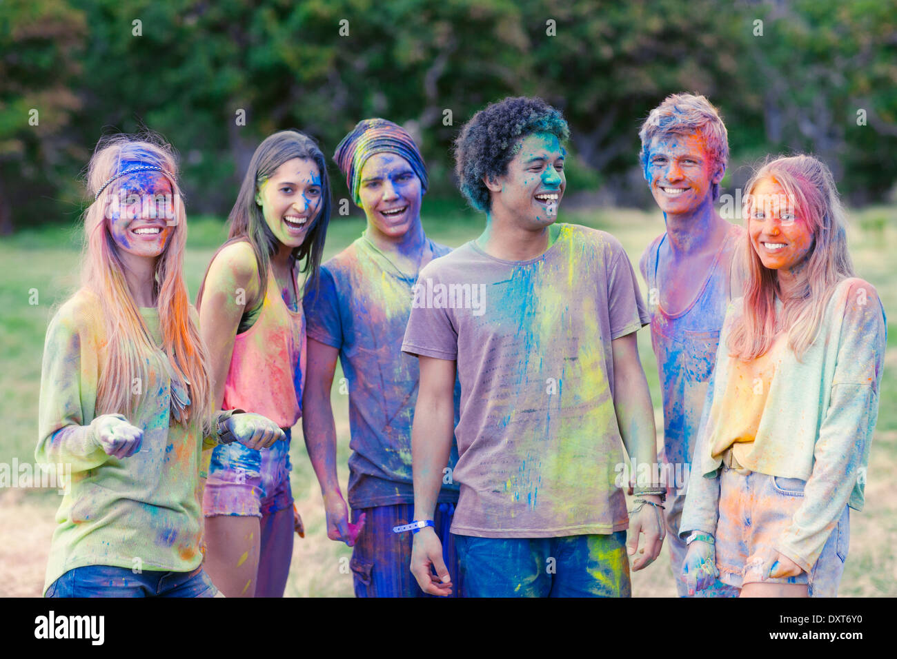 Portrait of friends covered in chalk dye Stock Photo
