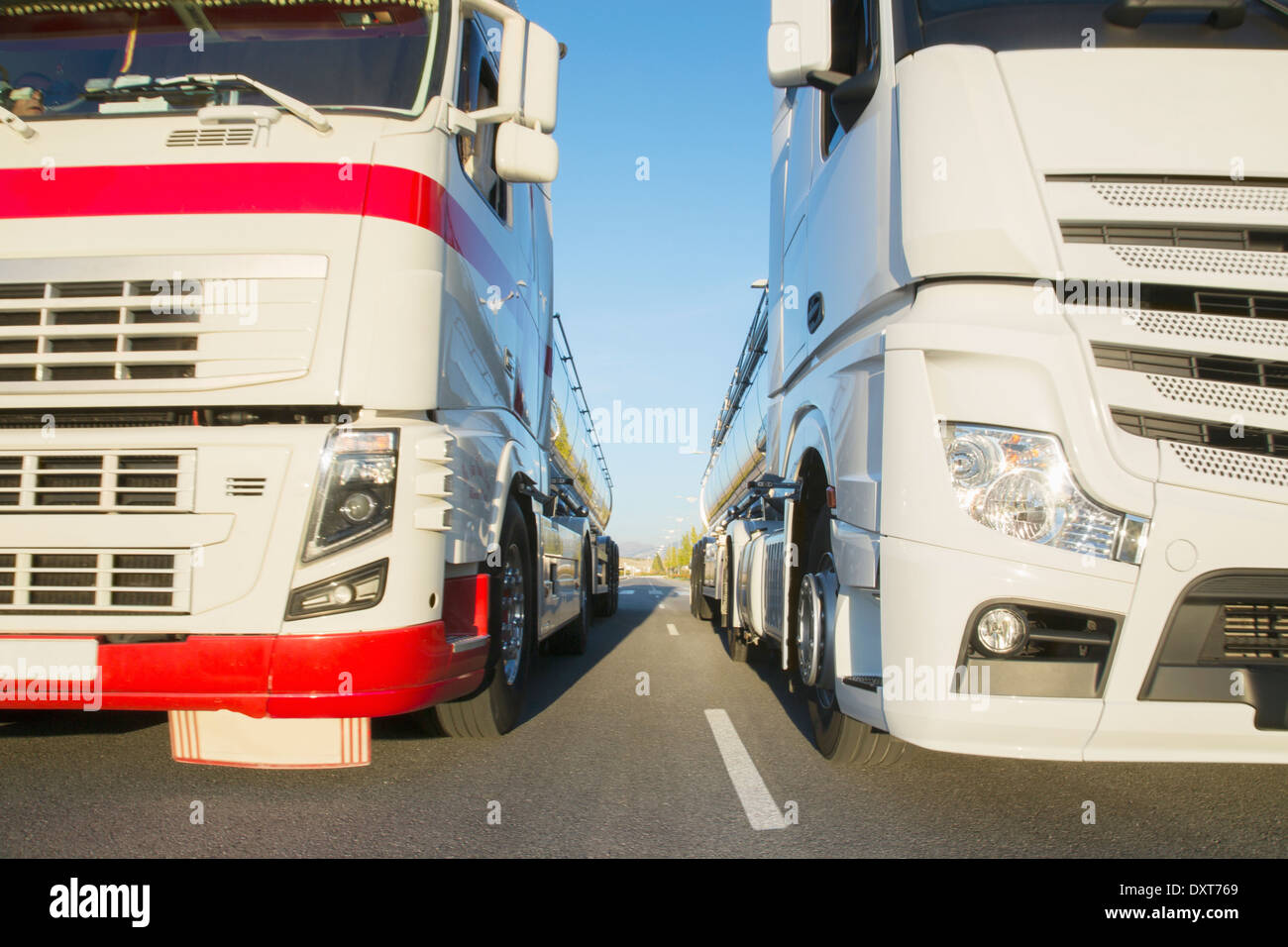Commercial trucks side by side on the road Stock Photo