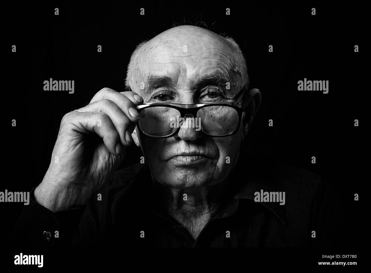 Artistic portrait of an old man with glasses Stock Photo Alamy