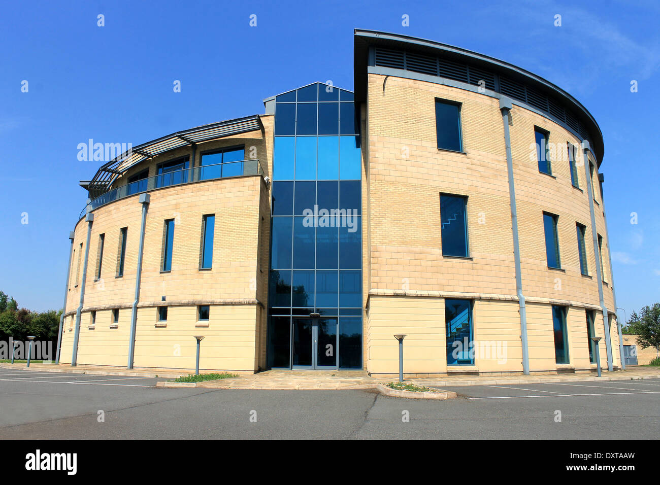 Exterior of empty modern office building with blue sky and cloudscape background. Stock Photo