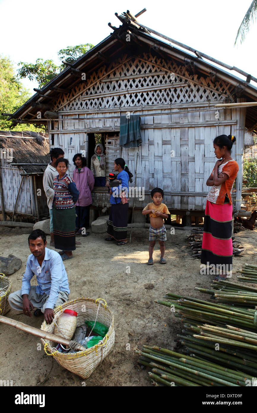 A hut and people of the Tripura tribe in the village of Hathi Banda in the Bandarban region of Bangladesh. Stock Photo