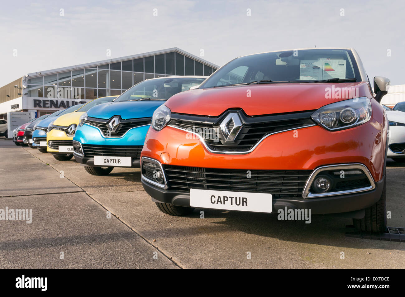 Line of new Renault Captur cars lined up on Renault car dealers