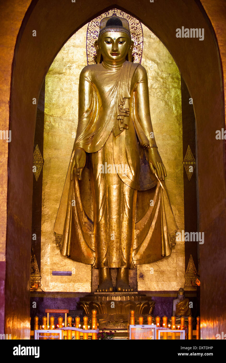 Huge golden Buddha, Ananda Pahto Buddhist Temple, Bagan Myanmar Stock Photo