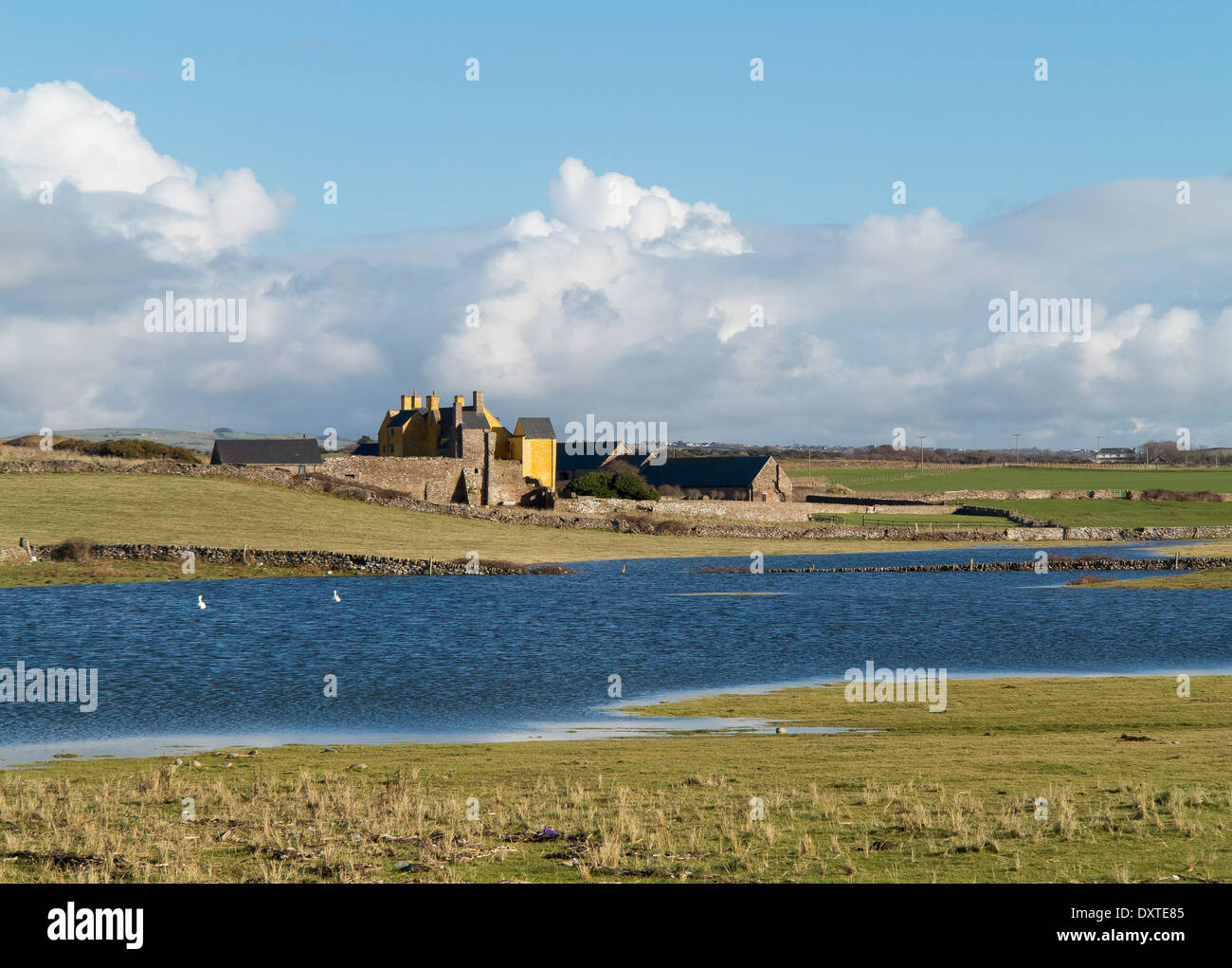 After the heavy rain of Winter 2013/14 a lake of water forms between Sker House, Porthcawl and the shoreline Stock Photo