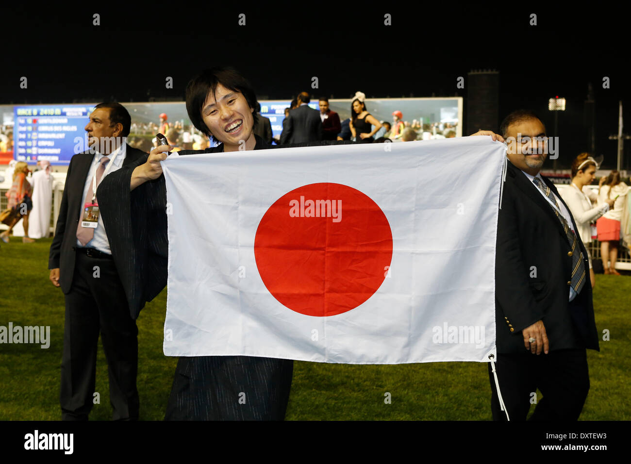 Dubai, UAE. 29th Mar, 2014. Impressions: Enthusiastic racegoers from japan celebrate the victory of Gentildonna in the Dubai Sheema Classic (Group 1). Credit:  dpa picture alliance/Alamy Live News Stock Photo