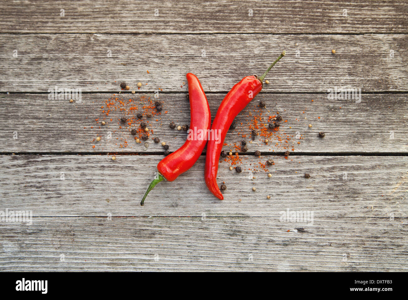 Red hot chili peppers on wooden background Stock Photo - Alamy