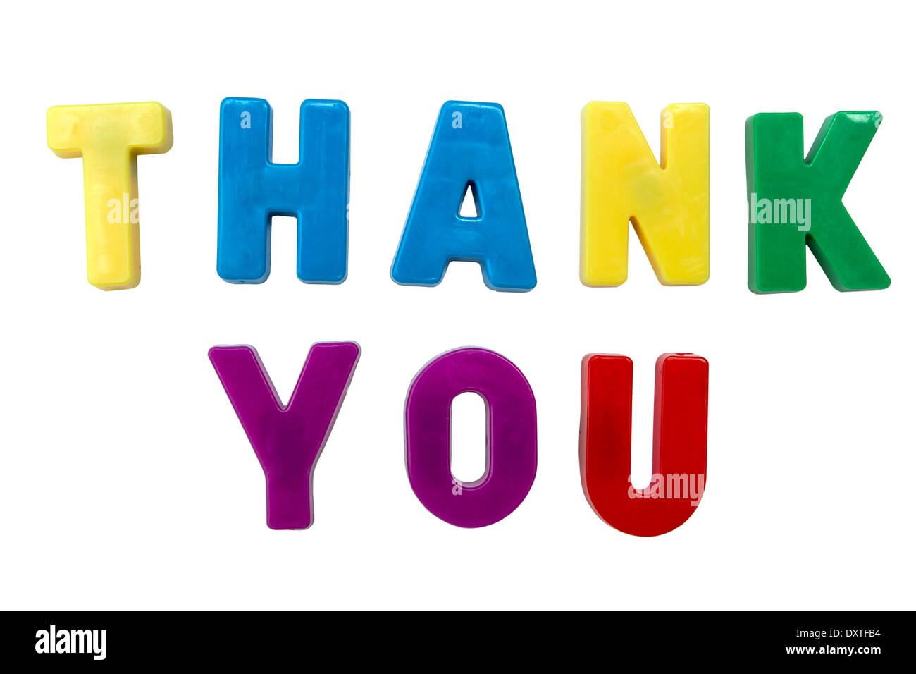 Colorful magnetic letters spelling out the words thank you on a white background. Stock Photo