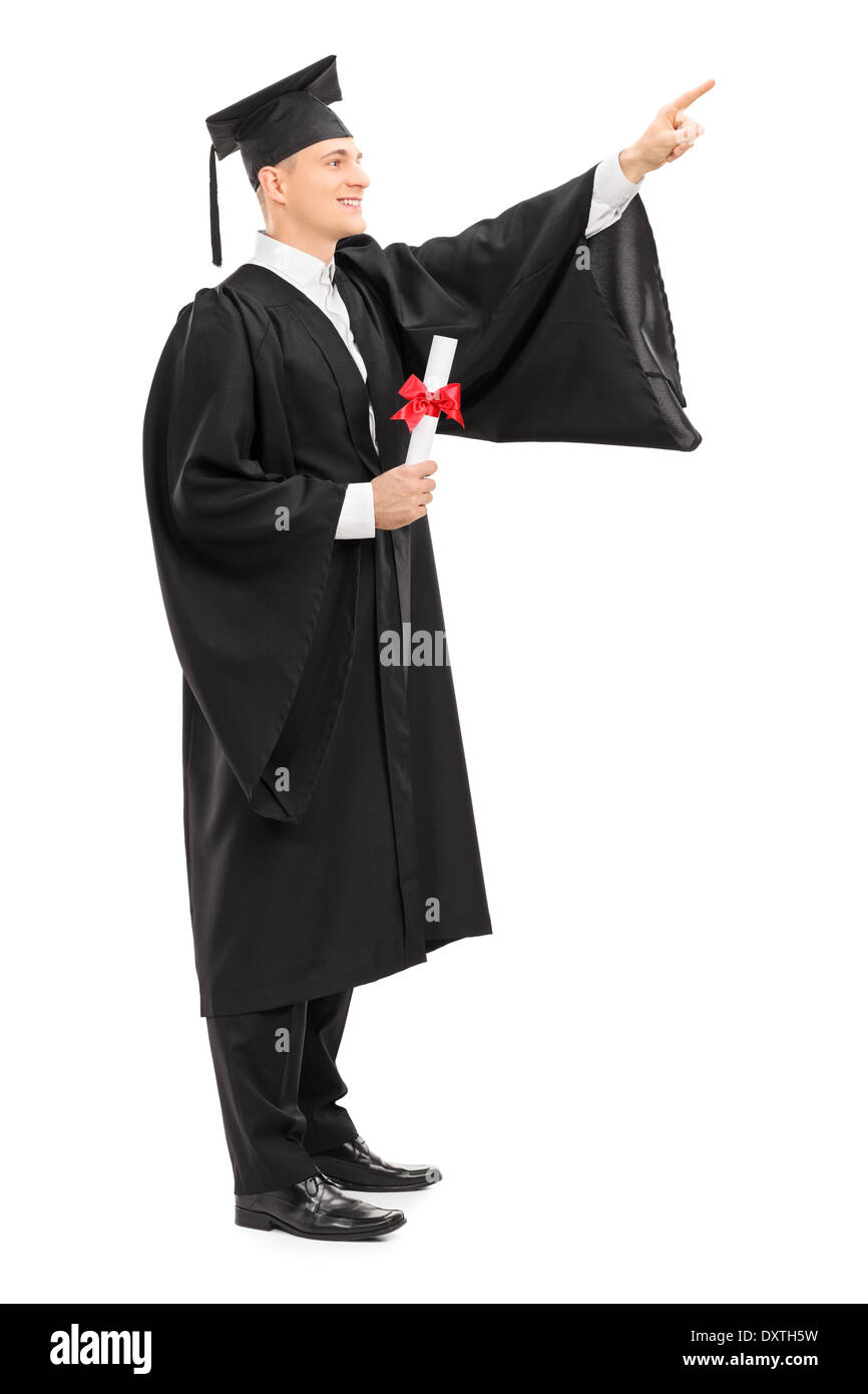 Male college graduate with a diploma pointing up Stock Photo
