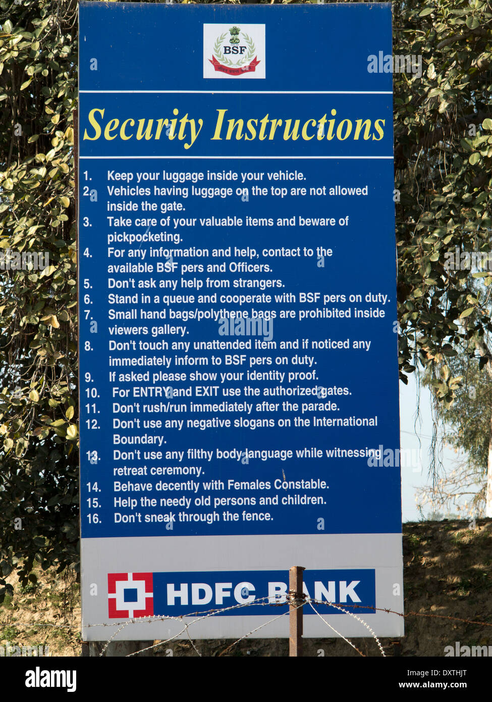India, Punjab, Amritsar, Wagah border post with Pakistan, hdfc bank sponsored security instruction sign Stock Photo