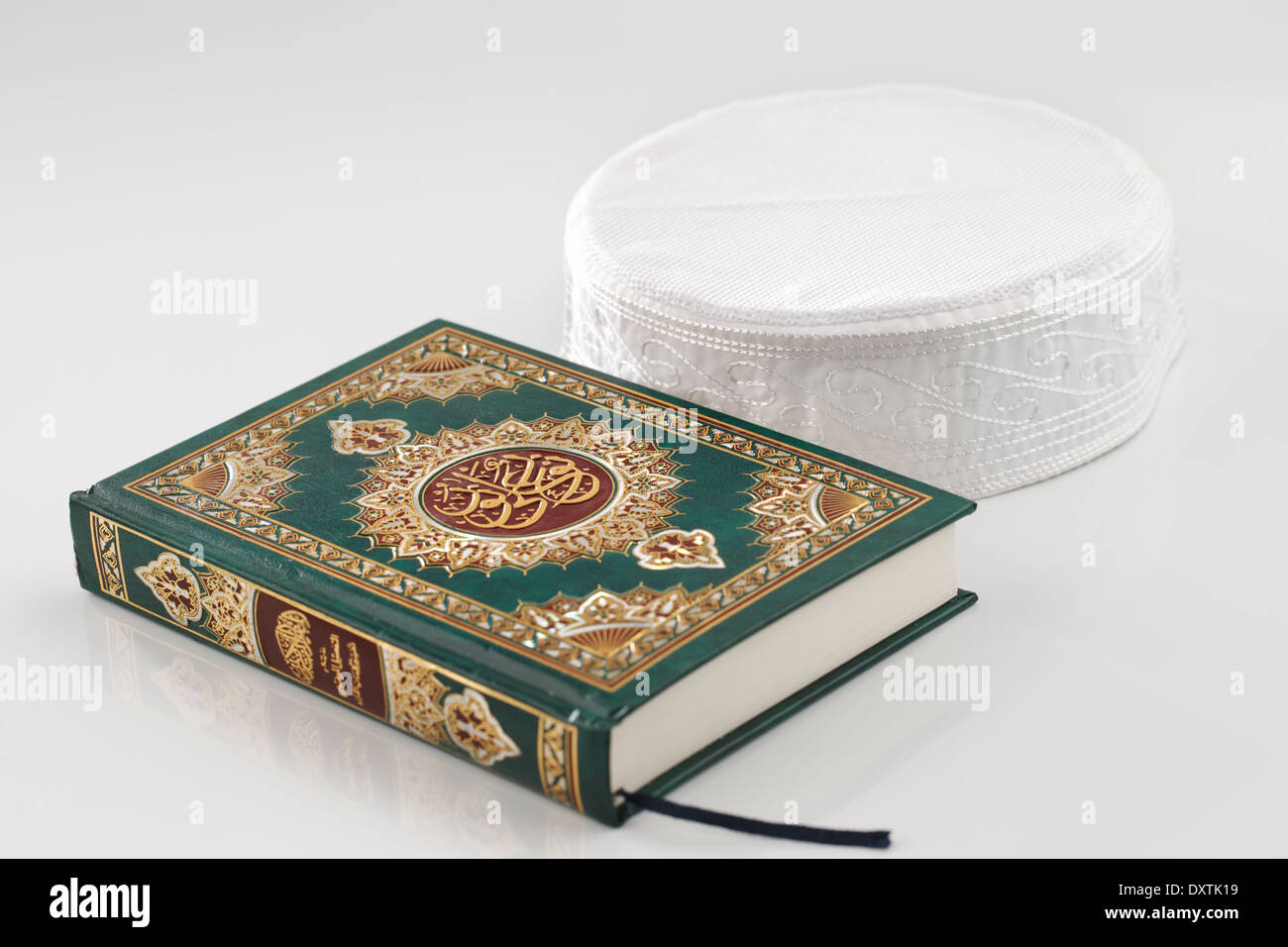 The Quran literally meaning 'the recitation', is the central religious text of Islam Stock Photo