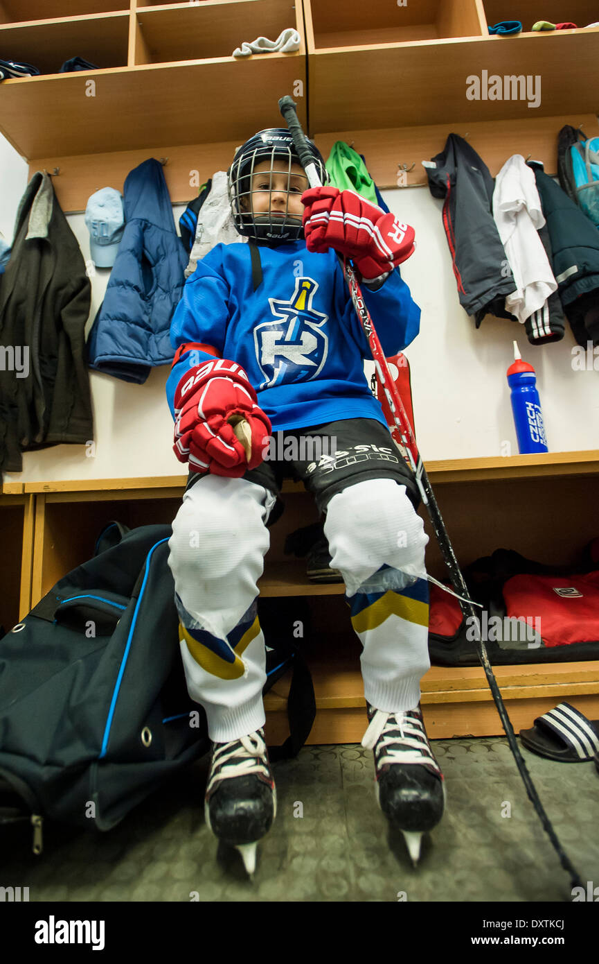 ice-hockey player baby boy in changing room Stock Photo