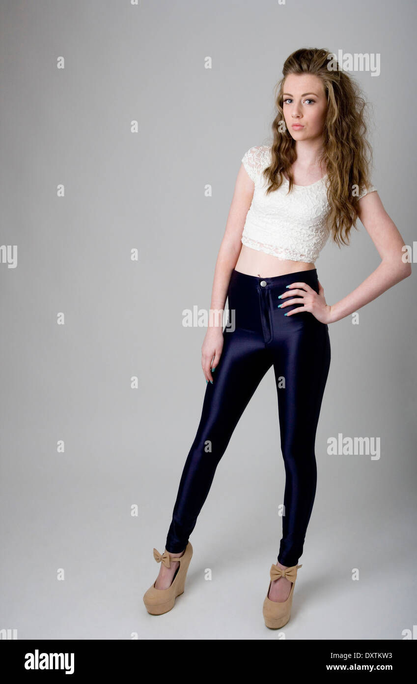 Portrait of a teenage girl wearing shiny leggings. Stock Photo