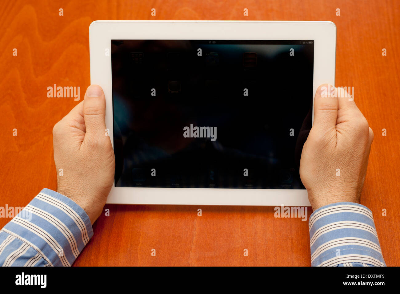 man holding an iPad tablet with blank screen Stock Photo