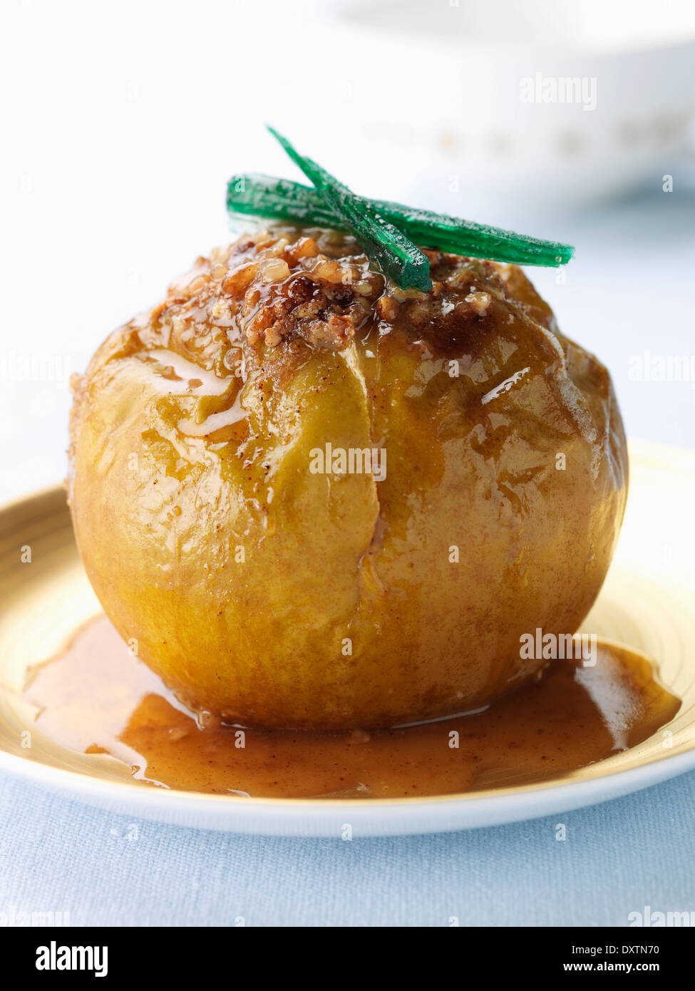 Bake apple stuffed with crushed hazelnuts,brown sugar and cinnamon Stock Photo