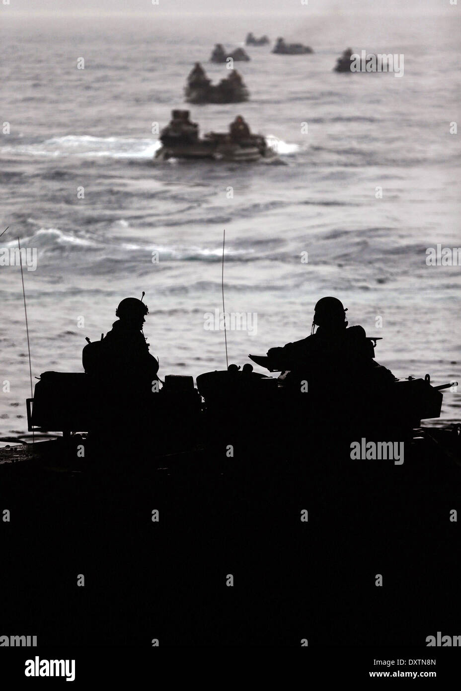 US Marines maneuver their AAV-7 amphibious vehicles off the USS Harper Ferry during amphibious assault training exercise Ssang Yong March 29, 2014 off Pohang, South Korea. Stock Photo