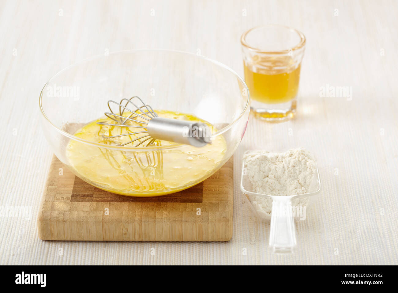 Mixing together the beaten eggs,flour and melted butter Stock Photo Alamy