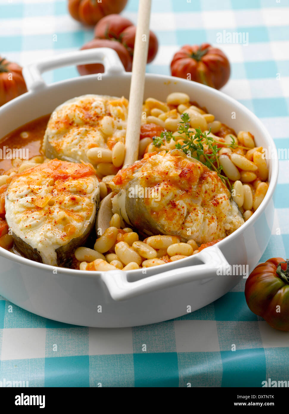 Conger eel steaks with butter beans Stock Photo