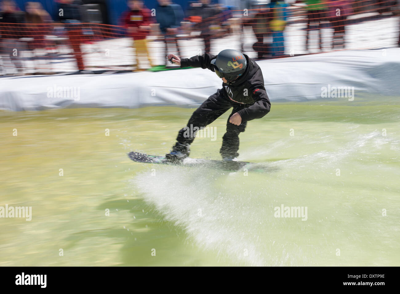 London, Ontario, Canada. 30th Mar, 2014. It has been a good year at Boler Mountain with skiing starting in November and likely running till the first weekend in March. At the end of each year the club holds its annual Slush Bowl, were contestants try to make it across a pool at the bottom of a run. Some do, many don't but they all wind up a little cold and wet at the end. Credit:  Mark Spowart/Alamy Live News Stock Photo