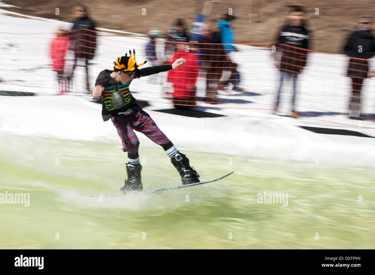 London, Ontario, Canada. 30th Mar, 2014. It has been a good year at Boler Mountain with skiing starting in November and likely running till the first weekend in March. At the end of each year the club holds its annual Slush Bowl, were contestants try to make it across a pool at the bottom of a run. Some do, many don't but they all wind up a little cold and wet at the end. Credit:  Mark Spowart/Alamy Live News Stock Photo