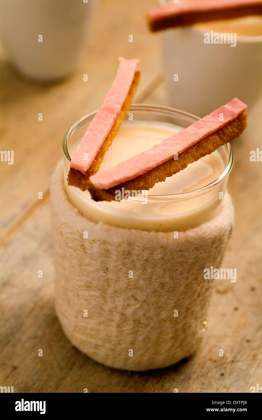 Cream of Jerusalem artichokes with fingers of bread and ham Stock Photo