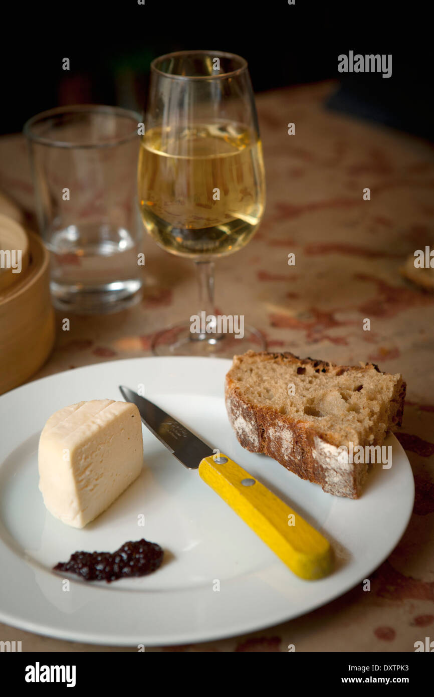 Tasting a glass of wine and a piece of cheese Stock Photo