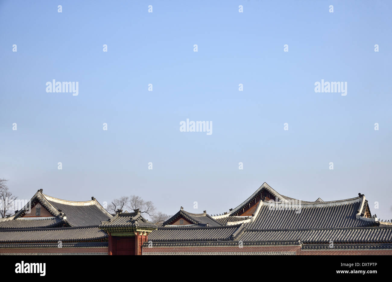 tiled roofs of Gyeongbokgung with clear sky in Seoul, Korea Stock Photo